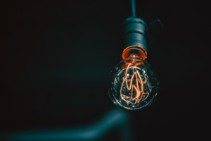 A light bulb on a dark background