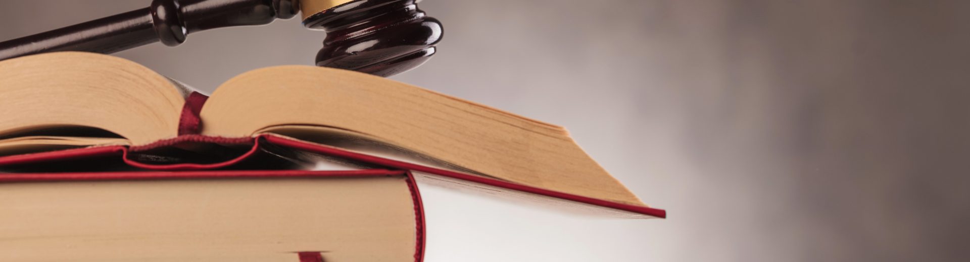 judge's gavel on top of a stack of books with copyspace in studio